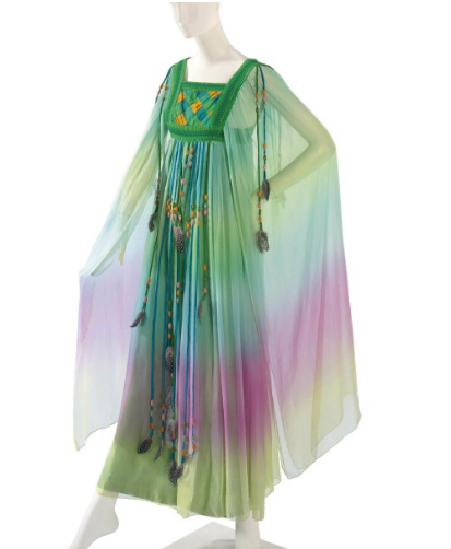 Taylor wore this long chiffon dress with long beaded feather trimmed 