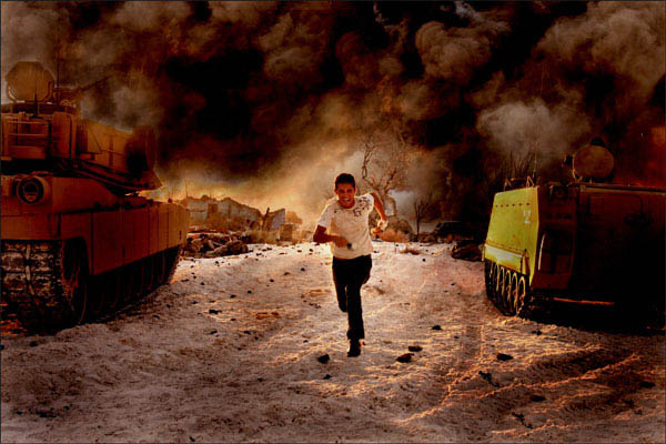 Shia LaBeouf running away from an explosion