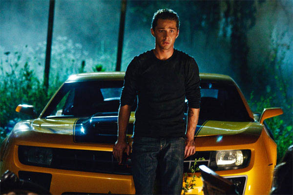 Shia LaBeouf in front of Bumblebee