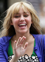 Miley Cyrus takes a break while filming Hannah Montana: The Movie