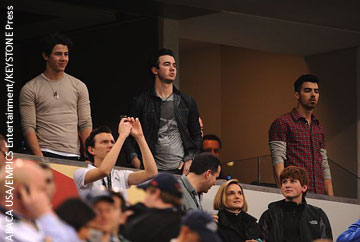 Nick, Kevin and Joe Jonas watched from the stands.