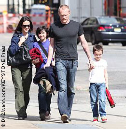 Jennifer Connelly holds hands with husband Paul Bettany