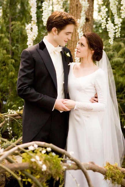 Edward (Robert Pattinson) and Bella (Kristen Stewart) are married in a beautiful ceremony and leave for the Cullen’s private island, Isle Esme, for their honeymoon. They have a romantic vacation until Bella suddenly gets sick and it becomes clear that against all odds, she’s pregnant.  