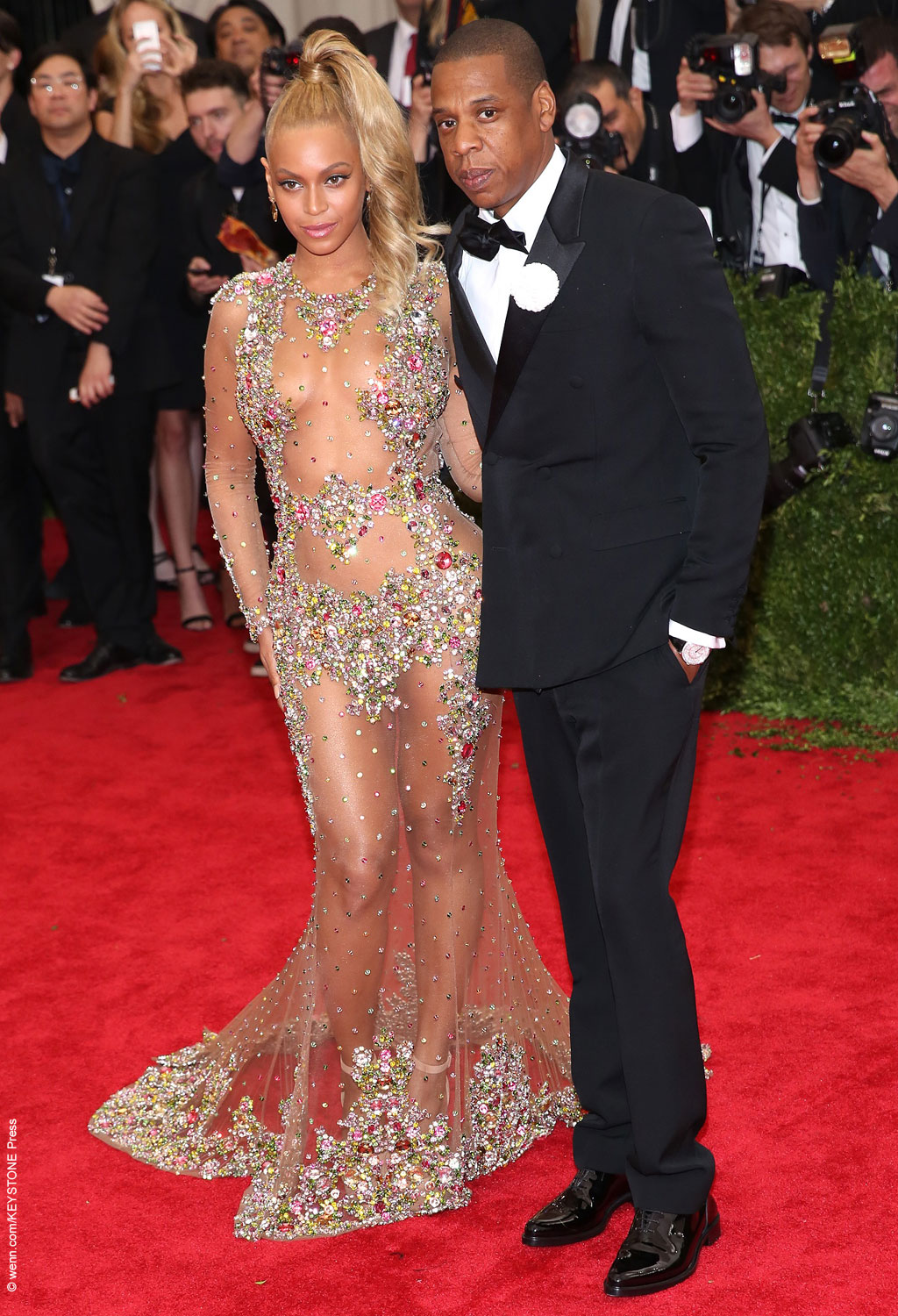 Beyoncé showed off her curves, walking the red carpet with husband Jay Z. She rocked a curled high ponytail and a sheer Givenchy gown, adorned with floral appliques and stones covering the parts that needed to be covered.