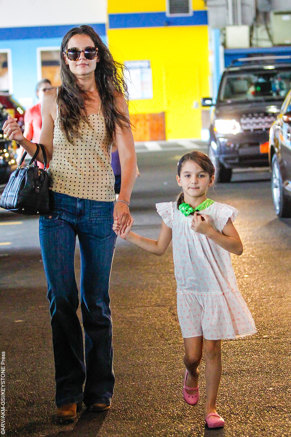 Katie Holmes and Suri Cruise are the cutest mother-daughter duo. Suri looks like her mother but you can also see a lot of her handsome father Tom Cruise in her as well.
