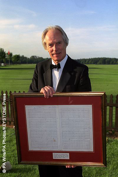 George Martin holding the original score for Eleanor Rigby