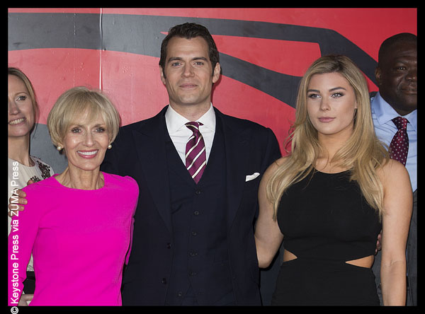 Henry Cavil with Tara King and his mother on the red carpet.