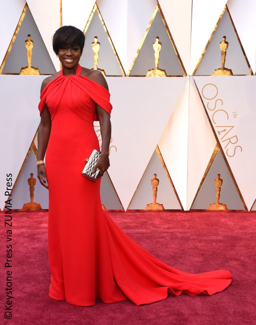 Best Supporting Actress Oscar winner Viola Davis was all set for her big win as she sported a crimson Armani Privé red gown draped casually over her shoulders. She definitely dressed the part and stunned on the red carpet.