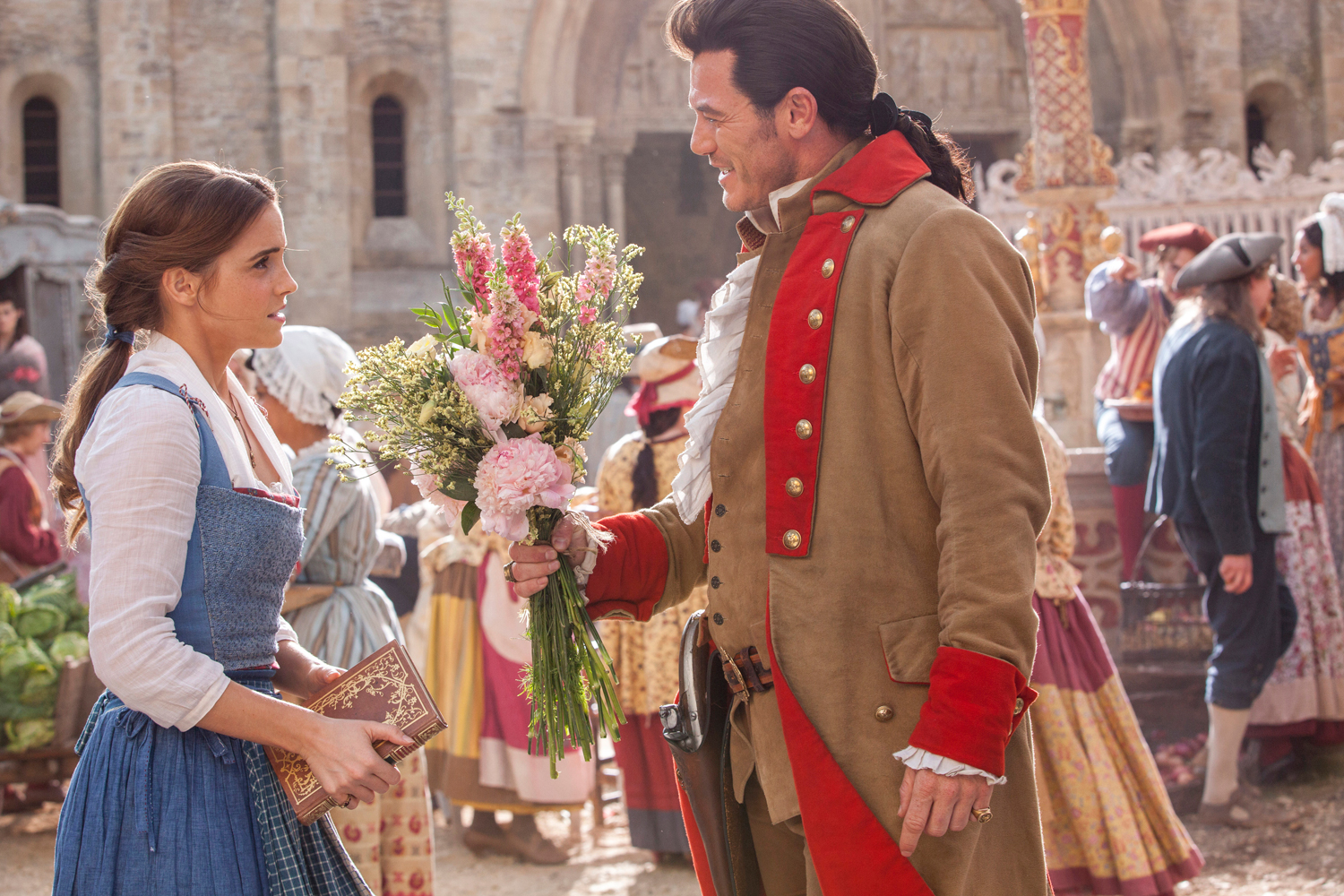 Belle (Emma Watson) and Gaston (Luke Evans)