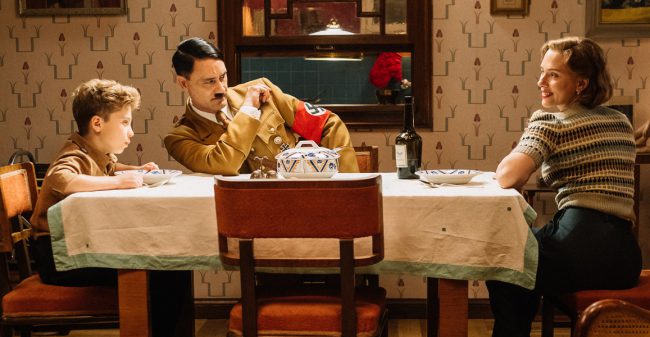 After director Taika Waititi hit the mainstream with 2017’s Thor: Raganarok, the Kiwi filmmaker goes back to his comedic roots with his Nazi satire, Jojo Rabbit. Following a young boy in the Hitler Youth organization who discovers his mother is hiding a Jewish girl, the film may cause controversy, but with a talented cast that […]