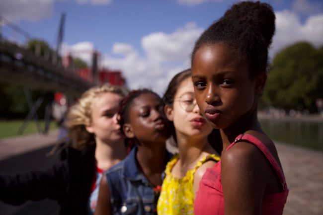 Amy (Fathia Youssouf Abdillahi), an 11-year-old French girl, upsets her mother when she tries to escape her family’s old world values by joining a free-spirited, self-trained dance group of four girls who name themselves the “Cuties,” as they prepare for an upcoming contest.