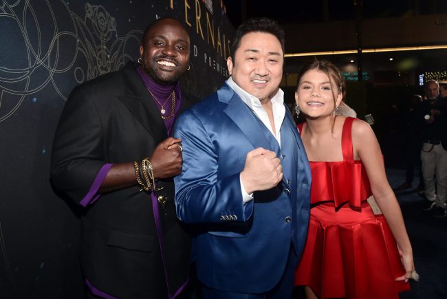 Brian Tyree Henry (Phastos), Don Lee (Gilgamesh) and Lia McHugh (Sprite) arrive at the Eternals premiere in Hollywood. (Photo by Alberto E. Rodriguez/Getty Images for Disney)