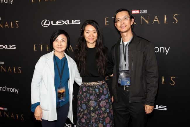 Director/screenwriter Chloé Zhao (center) and guests arrive on the red carpet. (Photo by Jesse Grant/Getty Images for Disney)