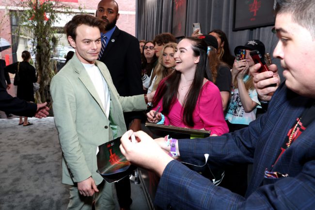 Charlie Heaton (Jonathan Byers), 28, greeted fans prior to the screening. He wore a moss green Richard James suit over a white mock turtleneck.