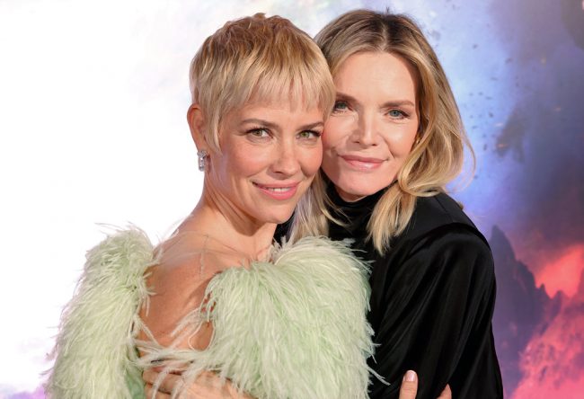 Evangeline Lilly (Hope Van Dyne) and Michelle Pfeiffer, who plays her mother, Janet Van Dyne in the film, embrace at the Ant-Man and The Wasp: Quantumania world premiere.