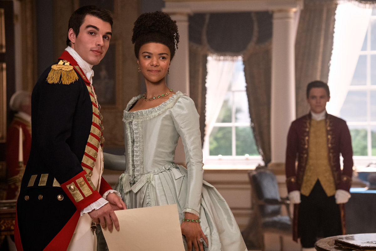 Queen Charlotte: A Bridgerton Story. Photo: Nick Wall/Netflix 2023. Corey Mylchreest as Young King George, India Amarteifio as Young Queen Charlotte, Sam Clemmett as Young Brimsley