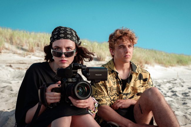 Two lifelong teenage friends enjoying summer at the beach meet a handsome, aspiring pro athlete whom they try to cast in their sensual short film.