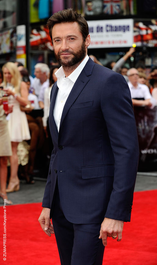 HUGH JACKMAN was as dashing as ever in a navy blue Louis Vuitton suit at  the premiere of Wolverine in London, U.K. He next appears in Prisoners.
