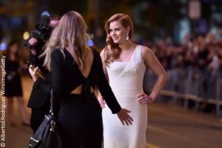 Amy Adams walks the red carpet before the screening of Nocturnal Animals