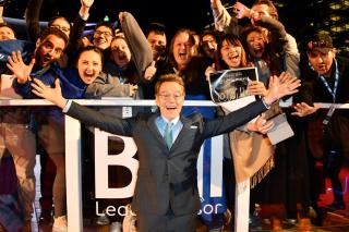 Bryan Cranston poses for photo with fans