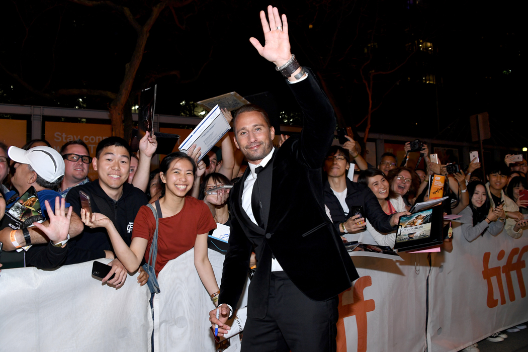 Matthias Schoenaerts greets fans on the Kursk red carpet