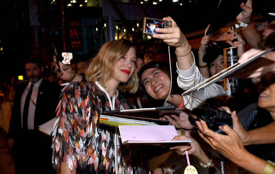 Léa Seydoux poses for fans on the Kursk red carpet